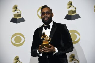 FILE - In this Jan. 26, 2020 file photo, PJ Morton poses in the press room with the award for best R&B song for "Say So" at the 62nd annual Grammy Awards at the Staples Center in Los Angeles. Morton is the first artist in residence at a historically Black private university in New Orleans. Dillard University announced that Morton will teach master classes in songwriting, music publishing, studio production and talent management during the 2021-22 academic year. .(AP Photo/Chris Pizzello, File)