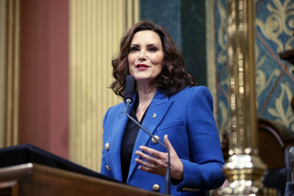 FILE - Michigan Gov. Gretchen Whitmer delivers her State of the State address to a joint session of the House and Senate, Jan. 25, 2023, at the state Capitol in Lansing, Mich. On Wednesday, Aug. 30, Whitmer will give the first insight into Democrats' plans for the final months of the year after a historic first half of 2023 that saw the newly powerful party rush through a flurry of pent-up policy demands. (AP Photo/Al Goldis, File)