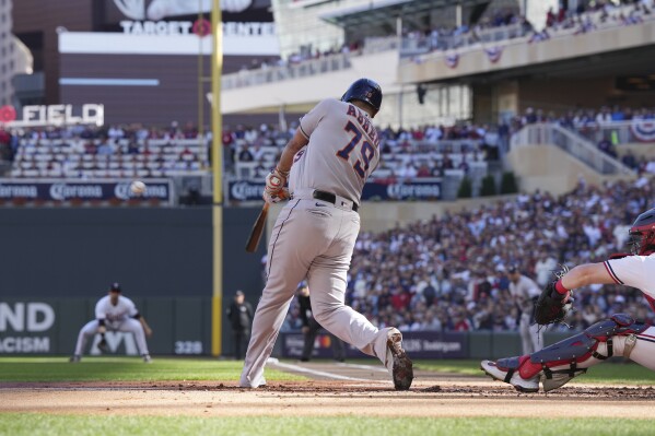 Houston Astros' Jose Abreu connects for a three-run home run during the first inning of Game 3 of an American League Division Series baseball game against the Minnesota Twins, Tuesday, Oct. 10, 2023, in Minneapolis. (AP Photo/Jordan Johnson)