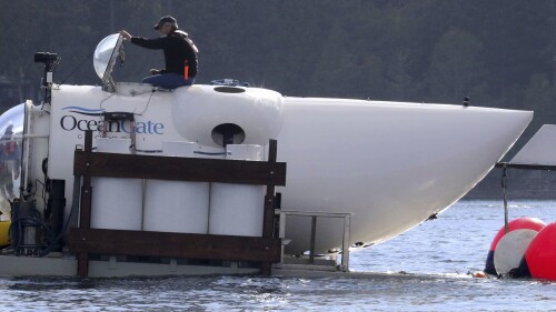 OceanGate CEO Stockton Rush emerges from the hatch atop the OceanGate submarine Cyclops 1 in the San Juan Islands, Wash., on Sept. 12, 2018. Rescuers in a remote area of the Atlantic Ocean raced against time Tuesday, June 20, 2023, to find a missing submersible before the oxygen supply runs out for five people, including Stockton, who were on a mission to document the wreckage of the Titanic. (Alan Berner/The Seattle Times via AP)