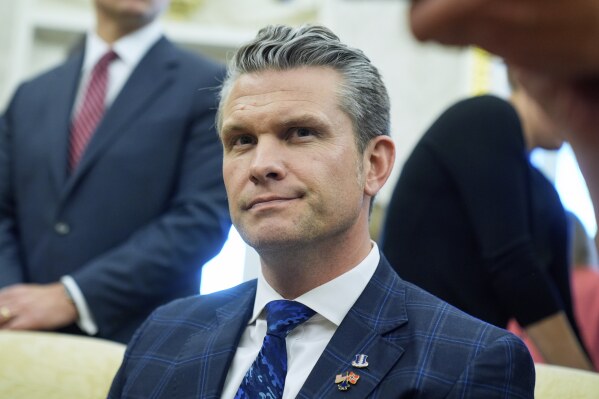 Secretary of Defense Pete Hegseth listens as President Donald Trump meets with Norwegian Prime Minister Jonas Gahr Støre during a bilateral meeting in the Oval Office of the White House, Thursday, April 24, 2025, in Washington. (AP Photo/Mark Schiefelbein)