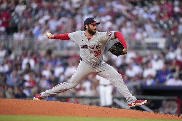 Washington Nationals pitcher Trevor Williams (32) delivers in the second inning of a baseball game against the Atlanta Braves, Thursday, May 30, 2024, in Atlanta. (AP Photo/Brynn Anderson)