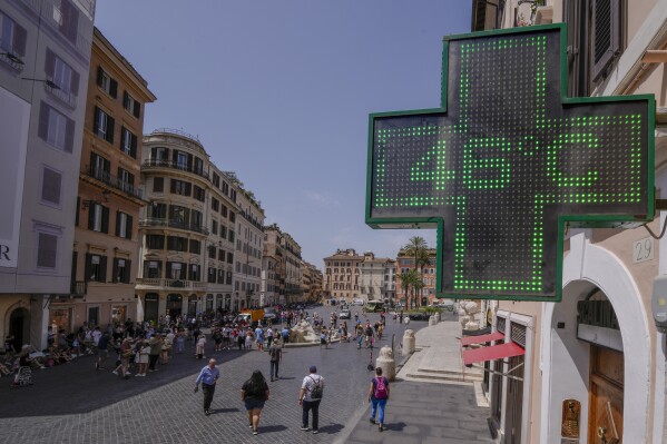 A Pharmacy shop sign displays the outside temperature of 46 Celsius degrees (114.8 F) in downtown Rome, Tuesday, July 18, 2023. Temperatures in Italy are officially registered only by the Italian Air Force's weather service while high temperatures picked by private stations need to be verified by the World Meteorological Organization, which only Monday accepted a new temperature record for continental Europe of 48.8 Celsius degrees (119.8 F), measured in Sicily on Aug. 11, 2021. (AP Photo/Domenico Stinellis)
