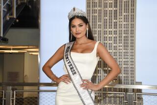 FILE - Newly crowned Miss Universe, Andrea Meza of Mexico, poses for the media during her visit to the Empire State Building on May 18, 2021, in New York. The next Miss Universe competition will take place in December in Eilat, Israel. The Miss Universe Organization also announced Tuesday, July 20, 2021, that the contest will again broadcast live in the U.S. on Fox with Steve Harvey returning to host. This will be the 70th Miss Universe competition and will end with Meza crowning her successor. (Photo by Evan Agostini/Invision/AP, File)
