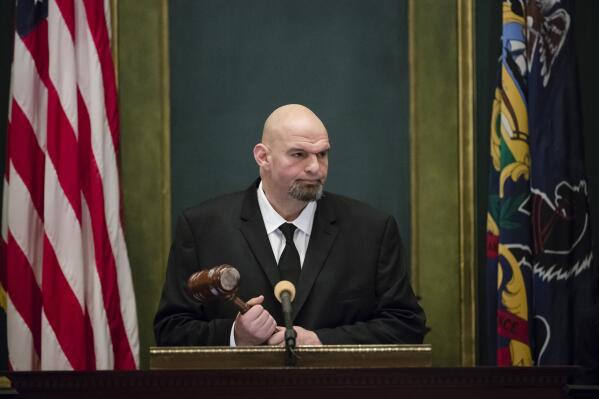 FILE - Pennsylvania Lt. Gov. John Fetterman John Fetterman holds a gavel after he was sworn into office on Jan. 15, 2019, at the state Capitol in Harrisburg, Pa. In 2019, Fetterman's first year in office, he regularly attended ribbon cuttings and conducted a statewide listening tour focused on legalizing marijuana. (AP Photo/Matt Rourke, File)