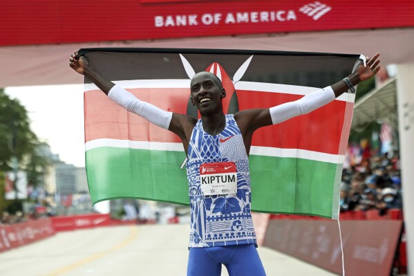 FILE - Kelvin Kiptum of Kenya celebrates his Chicago Marathon world record victory in Chicago's Grant Park on Sunday, Oct. 8, 2023. According to a fellow athlete, Kiptum died in a car crash in Kenya late Sunday, Feb. 11, 2024. He was 24. (Eileen T. Meslar/Chicago Tribune via AP)