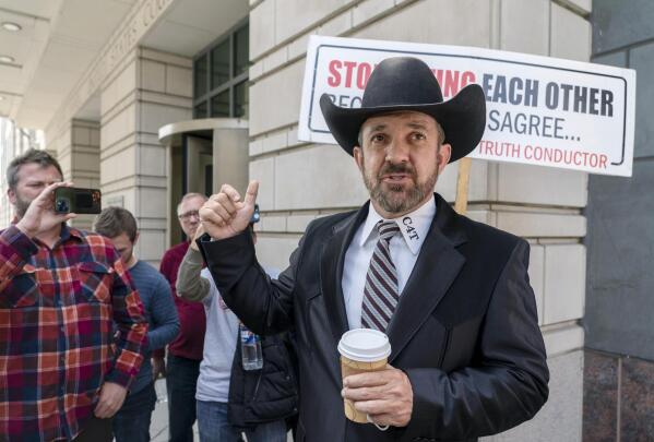 Otero County, New Mexico Commissioner Couy Griffin gestures as he speaks outside the federal court after receiving a verdict in his trial, Tuesday, March 22, 2022 in Washington. A federal judge has convicted Griffin of illegally entering restricted U.S. Capitol grounds, but acquitted him of engaging in disorderly conduct during the riot that disrupted Congress from certifying Joe Biden’s presidential election victory.  (AP Photo/Gemunu Amarasinghe)