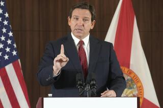 FILE - Florida Gov. Ron DeSantis gestures during a news conference, Jan. 26, 2023, in Miami. Gov. DeSantis has signed a bill ending a unanimous jury requirement in death penalty sentencing, a response to a verdict that spared the life of a school shooter who killed 17 people. DeSantis, a Republican, signed the bill in a private ceremony Thursday, April 20, 2023. (AP Photo/Marta Lavandier, File)