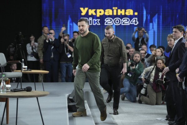 Ukrainian President Volodymyr Zelensky arrives before a press conference in Kiev, Ukraine, on Sunday, February 25, 2024.  (AP Photo/Evgeny Maloletka)