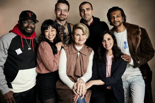 
              Lil Rel Howery, from left, Alice Lee, Micah Stock, Jillian Bell, director Paul Downs Colaizzo, Michaela Watkins and Utkarsh Ambudkar pose for a portrait to promote the film "Brittany Runs A Marathon" at the Salesforce Music Lodge during the Sundance Film Festival on Sunday, Jan. 27, 2019, in Park City, Utah. (Photo by Taylor Jewell/Invision/AP)
            