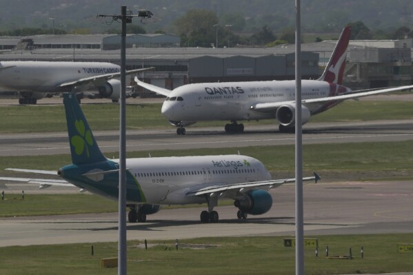 Airplanes are seen at the Heathrow Airport in London, May 27, 2023. (AP Photo/Kin Cheung, File)
