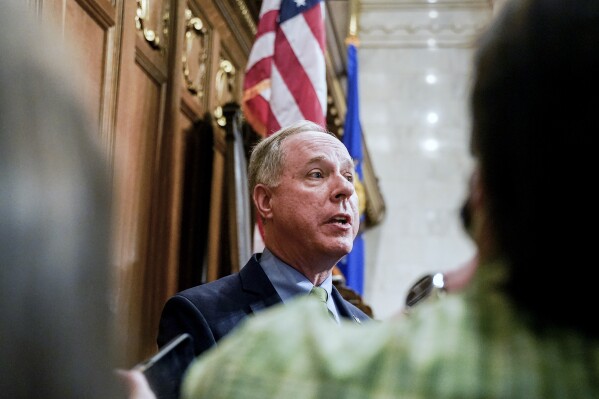 FILE - Wisconsin Assembly Speaker Robin Vos talks to the media at the state Capitol, Feb. 15, 2022, in Madison, Wis. Republicans who control the Wisconsin Legislature are withholding pay raises for Universities of Wisconsin employees amid a fight over the school system's diversity, equity and inclusion spending. The Legislature's employment relations committee voted to approve raises for other state employees but did not take action on UW wage increases on Tuesday, Oct. 17, 2023. Vos, who chairs the committee, has promised to block raises for UW employees until the school system cuts so-called DEI spending by $32 million. (AP Photo/Andy Manis, File)