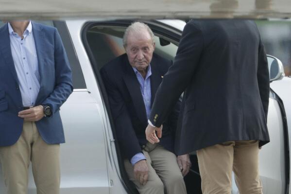Spain's former King Juan Carlos gets into a car on arrival by private jet at the Peinador airport in Vigo, north western Spain, Thursday, May 19, 2022. Spain's former King has returned to Spain Thursday for his first visit since leaving nearly two years ago amid a cloud of financial scandals. (AP Photo/Lalo R. Villar)