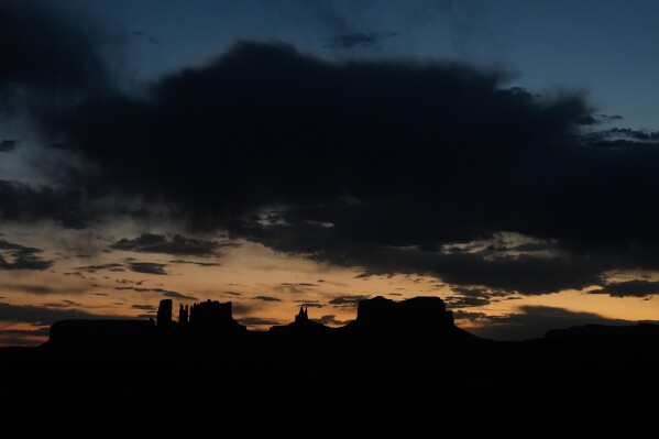 The sun sets, Tuesday, Oct. 8, 2024, near Monument Valley on the Navajo Nation in Halchita, Utah. (AP Photo/Joshua A. Bickel)