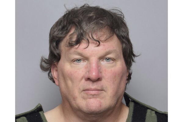 This booking image provided by Suffolk County Sheriff’s Office, shows Rex Heuermann, a Long Island architect who was charged Friday, July 14, 2023, with murder in the deaths of three of the 11 victims in a long-unsolved string of killings known as the Gilgo Beach murders. (Suffolk County Sheriff’s Office via AP0