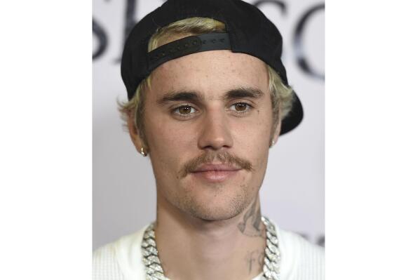 FILE - In this Jan. 27, 2020, file photo, Justin Bieber arrives at the Los Angeles premiere of "Justin Bieber: Seasons." Justin Bieber leads this year’s list of nominees at the 2021 MTV Video Music Awards, followed closely by Megan Thee Stallion, Billie Eilish, BTS, Doja Cat, Drake, Giveon, Lil Nas X and first-time nominee Olivia Rodrigo.
Bieber has seven nods, including video of the year and best direction for “POPSTAR,” artist of the year, best cinematography for “Holy” and best pop song, best editing and best collaboration for “Peaches.”  (Photo by Jordan Strauss/Invision/AP, File)