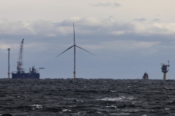 The first operating South Fork Wind farm turbine, Thursday, Dec. 7, 2023, 35 miles east of Montauk Point, N.Y. The turbine at the commercial-scale offshore wind farm is producing power for the U.S. electric grid for the first time. (AP Photo/Julia Nikhinson)