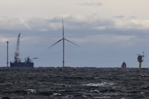 The first operating South Fork Wind farm turbine, Thursday, Dec. 7, 2023, 35 miles east of Montauk Point, N.Y. The turbine at the commercial-scale offshore wind farm is producing power for the U.S. electric grid for the first time. (APPhoto/Julia Nikhinson)