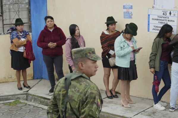 People lines to vote in the presidential election runoff in Pujili, Ecuador, Sunday, April 13, 2025. (AP Photo/Dolores Ochoa)