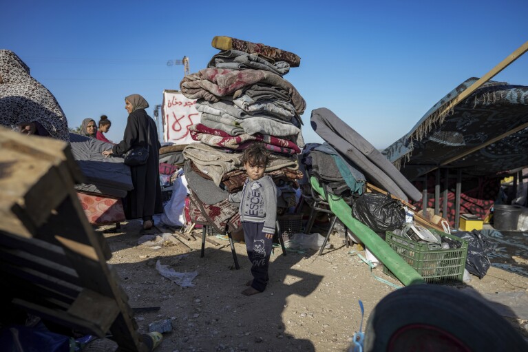 FILE - Displaced Palestinians arrive in central Gaza after fleeing from the southern Gaza city of Rafah in Deir al Balah, on May 8, 2024. (AP Photo/Abdel Kareem Hana, File)