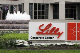 FILE - The Eli Lilly corporate headquarters is pictured April 26, 2017, in Indianapolis. A drug company says that adding an anti-inflammatory medicine to a drug already widely used for hospitalized COVID-19 patients shortens their time to recovery by an additional day. Eli Lilly announced the results Monday, Sept. 14, 2020, from a 1,000-person study sponsored by the U.S. National Institute of Allergy and Infectious Diseases. (AP Photo/Darron Cummings, File)