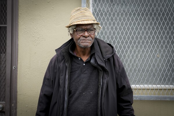 Larry James Bell, a homeless man, stands on the sidewalk Tuesday, Sept. 10, 2024, in San Francisco. (AP Photo/Terry Chea)