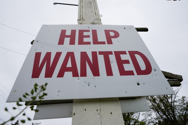 A help wanted sign is posted in Lansdale, Pa., Friday, April 28, 2023. (AP Photo/Matt Rourke, File)