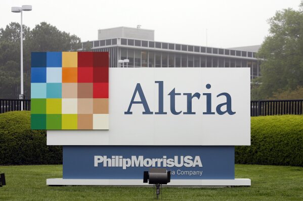 
              FILE - This April 23, 2008, file photo, shows the Altria Group Inc. corporate headquarters in Richmond, Va. The potential entry of one of the world’s largest tobacco companies into the marijuana business is sending the shares of Cronos group rocketing this morning. Cronos is a Canadian cannabis company, which confirmed late Monday, Dec. 3, 2018, that it is in talks with Altria group about a possible investment. (AP Photo/Steve Helber, File)
            