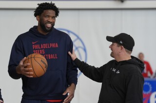 Philadelphia 76ers center Joel Embiid and head coach Nick Nurse meet at the NBA basketball team's practice facility, Thursday, Feb. 29, 2024, in Camden, N.J. (AP Photo/Matt Rourke)