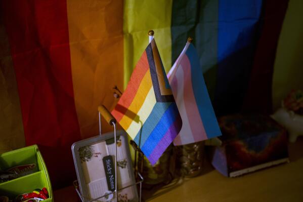 Pride flags are displayed in the bedroom of high school student Leo Burchell in Pennsylvania on Wednesday, Nov. 16, 2022. As politicians and activists push for limits on discussions of race, gender and sexuality, some students say the measures targeting aspects of their identity have made them less welcome in American schools — the one place where all kids are supposed to feel safe. (AP Photo/Joe Lamberti)