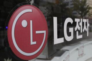 FILE - This Oct. 26, 2017 file photo shows the corporate logo of LG Electronics in Goyang, South Korea.  U.S. safety regulators have opened an investigation into electric and hybrid vehicle batteries, Tuesday, April 5, 2022,  after seven automakers issued recalls for defects that can cause fires or stalling. The National Highway Traffic Safety Administration says the probe covers more than 138,000 vehicles with batteries made by LG Energy Solution of South Korea.(AP Photo/Lee Jin-man, File)