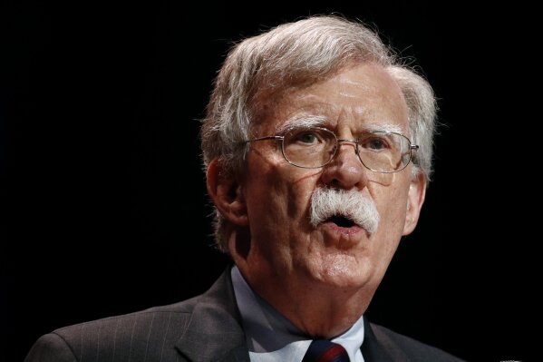 FILE - In this July 8, 2019, file photo, national security adviser John Bolton speaks at the Christians United for Israel's annual summit, in Washington.  A single paper copy in a nondescript envelope arrived at the White House on Dec. 30. Four weeks later, news of John Bolton’s book manuscript about his time as President Donald Trump’s national security adviser has exploded into public view, sending a jolt through the president’s impeachment trial. (AP Photo/Patrick Semansky, File)