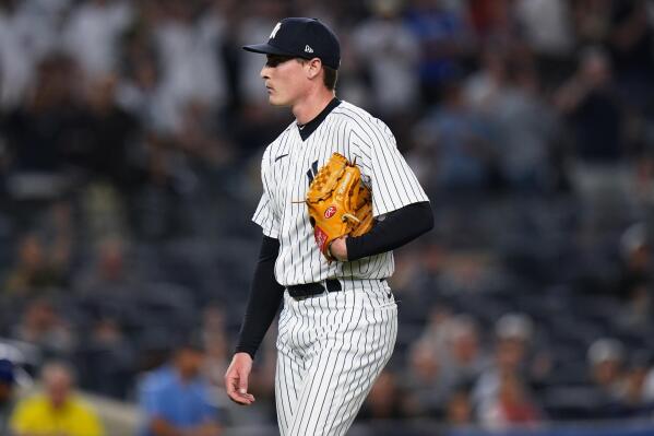 New York Yankees relief pitcher Ron Marinaccio walks to the dugout during the 13th inning of the team's baseball game against the Chicago Cubs on Friday, June 10, 2022, in New York. The Yankees won 2-1. (AP Photo/Frank Franklin II)