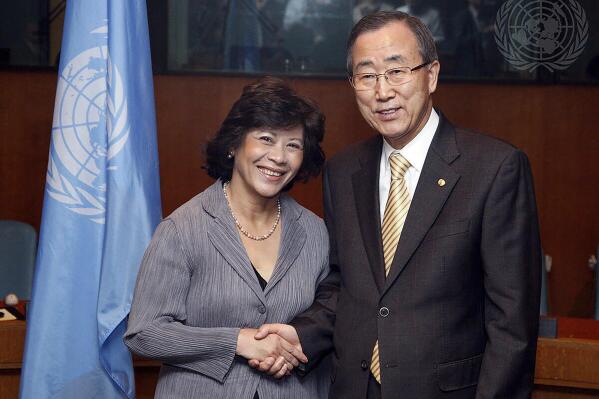 In this photo released by U.N. Photo, then U.S. Secretary-General Ban Ki-moon, right, poses with Noeleen Heyzer, then executive secretary of the Economic and Social Commission for Asia and the Pacific, for a photo after the two signed the 2009 Senior Management Compact Agreement, at U.N. headquarters on Feb. 12, 2009. Secretary-General Antonio Guterres on Monday, Oct. 25, 2021 announced the appointment of former U.N. undersecretary-general Heyzer of Singapore as the new U.N. special envoy for conflict-torn Myanmar. (U.N. Photo via AP)