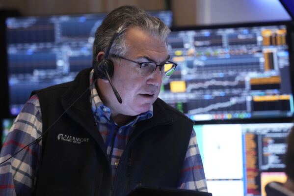 Trader John Bishop works on the floor of the New York Stock Exchange, Thursday, April 10, 2025. (AP Photo/Richard Drew)