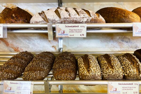 Bread is displayed for sale at the family bakery of Engelbert Schlechtrimen in Cologne, Germany, Wednesday, Sept. 21, 2022. For 90 years, the family of Engelbert Schlechtrimen has been baking wheat rolls, rye bread, apple, cheese and chocolate cakes in Cologne, but next month they'll turn off the ovens for good because they can no longer afford the rising energy prices resulting from Russia's war in Ukraine. (AP Photo/Daniel Niemann)