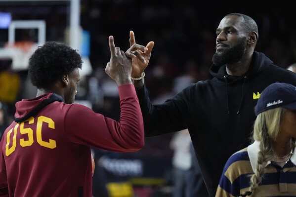 LeBron James inks sports trading card deal with Fanatics, will appear in  card with Bronny | AP News