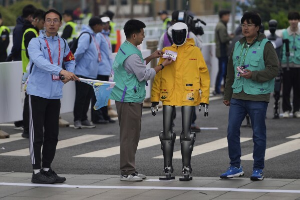 A robot takes part in what is billed as the world's first robot half marathon during the Humanoid Robot Half-Marathon held in Beijing on Saturday, April 19, 2025. (AP Photo/Ng Han Guan)