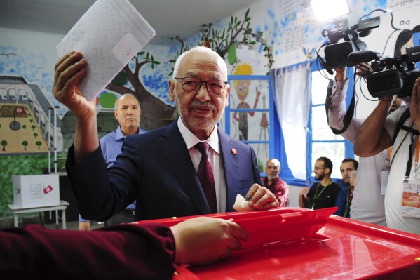 FILE - President of the Islamist party Ennahda and candidate for the Parliamentary election Rached Ghannouchi votes in a polling station south of Tunis, Tunisia, Sunday, Oct. 6, 2019. Tunisia's leading opposition figure was sentenced Thursday Feb.1, 2024 to three years in prison for accepting external financing. Rached Ghannouchi, the 82-year-old leader of Ennahda, is among the critics of President Kais Saied to face prison sentences amid a broader crackdown on opponents. (AP Photo/Hassene Dridi, File)