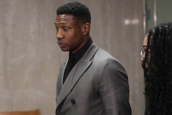 Jonathan Majors leaves a courtroom in New York, Dec. 18, 2023. Majors' former girlfriend is suing him on civil allegations including assault, battery, defamation and infliction of emotional distress. The lawsuit by Grace Jabbari comes three months after Majors was convicted in a criminal trial of assaulting her in New York City last year. The 31-year-old British dancer filed the action in federal court in Manhattan on Tuesday, March 19, 2024 claiming Majors subjected her to escalating incidents of physical and verbal abuse from 2021 to 2023. (AP Photo/Seth Wenig)