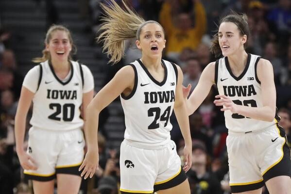 Iowa guards Gabbie Marshall (24) and Caitlin Clark, right, celebrate their consecutive three point baskets against Maryland in the first half of an NCAA college basketball game at the Big Ten women's tournament Saturday, March 4, 2023, in Minneapolis. Iowa won 89-84. (AP Photo/Bruce Kluckhohn)