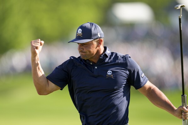 Bryson DeChambeau celebrates after a birdie on the 18th hole during the final round of the PGA Championship golf tournament at the Valhalla Golf Club, Sunday, May 19, 2024, in Louisville, Ky. (AP Photo/Sue Ogrocki)