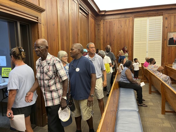 Sapelo Island residents and descendants leave the McIntosh County Courthouse after the Commission voted to approve the amendment to allow larger homes to be built in the historic Gullah Geechee community of Hog Hammock on Tuesday, Sept. 12, 2023, at the County Courthouse in Darien, Ga. (Richard Burkhart/Savannah Morning News via AP)