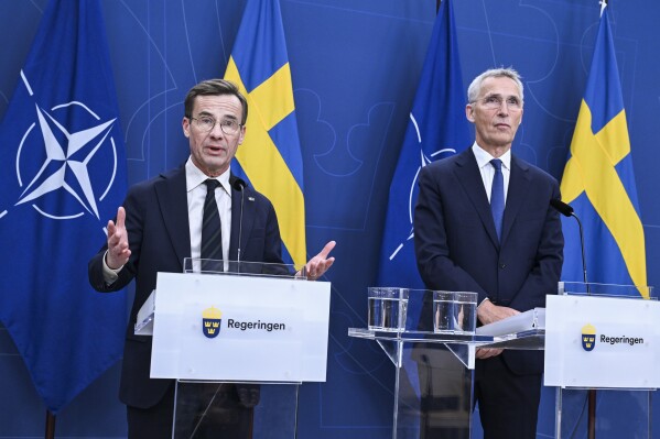 FILE - Swedish Prime Minister Ulf Kristersson, left, speaks during a press conference with NATO Secretary General Jens Stoltenberg at the Swedish Government headquarters Rosenbad in Stockholm, Oct. 24, 2023. Hungary's parliament approved Sweden's application to join NATO on Monday, Feb. 26, 2024, paving the way for the Scandinavian country to become the alliance's 32nd member. (Jonas Ekstromer/TT News Agency via AP, File)