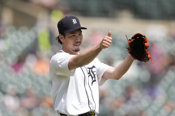 Detroit Tigers starting pitcher Kenta Maeda points to first baseman Spencer Torkelson after a play to end the fifth inning of a baseball game against the St. Louis Cardinals, Wednesday, May 1, 2024, in Detroit. (AP Photo/Carlos Osorio)