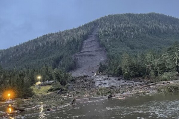 This photo provided by the Alaska Department of Public Safety shows the landslide that occurred the previous evening near Wrangell, Alaska, on Nov. 21, 2023. Authorities said at least one person died and others were believed missing after the large landslide roared down a mountaintop into the path of three homes. (Alaska Department of Public Safety via AP)