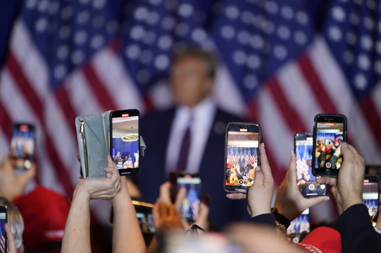 FILE - Republican presidential candidate former President Donald Trump speaks at an election night rally on primary election night in Nashua, N.H., Tuesday, Jan. 23, 2024. Election experts say they are concerned about AI’s potential to upend elections around the world through convincing deepfakes and other content that could mislead voters. (AP Photo/David Goldman, File)