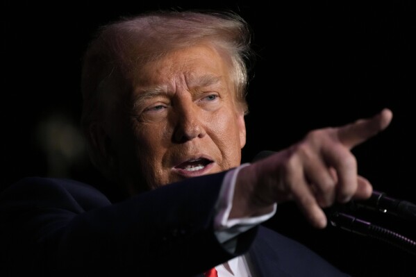 Former President Donald Trump speaks during a commit to caucus rally, Sunday, Oct. 29, 2023, in Sioux City, Iowa. (AP Photo/Charlie Neibergall)
