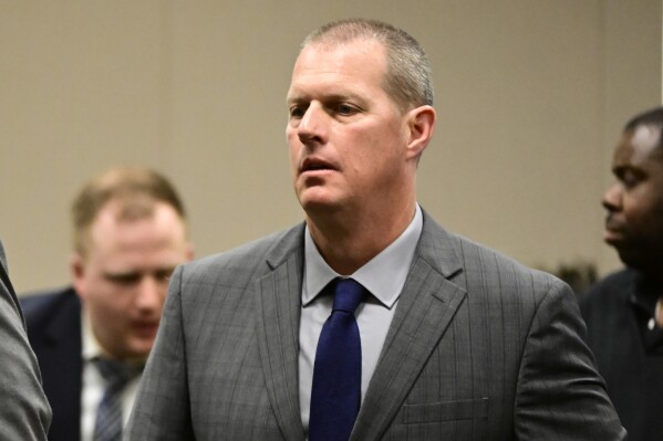 FILE - Paramedic Peter Cichuniec attends his arraignment at the Adams County Justice Center in Brighton, Colo., Friday, Jan. 20, 2023. Cichuniec, the senior medical responder on the scene during the altercation with Elijah McClain, faces a yearslong prison sentence when he is expected to be sentenced on Friday, March 1, 2024. A jury found him guilty in December for his involvement in the 2019 death of McClain following an overdose of a powerful sedative. (Andy Cross/The Denver Post via AP, File)