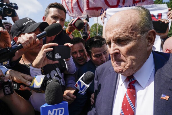 FILE - Rudy Giuliani speaks outside the Fulton County jail, Wednesday, Aug. 23, 2023, in Atlanta. Giuliani on Friday, Sept. 1, pleaded not guilty to Georgia charges that accuse him of trying, along with former President Donald Trump and others, to illegally overturn the results of the 2020 election in the state. (AP Photo/Brynn Anderson, File)